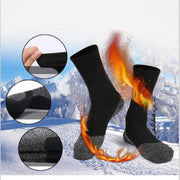 Black 35° Below high-tube thermal winter socks with a soft inner lining and reinforced grey heel and toe areas