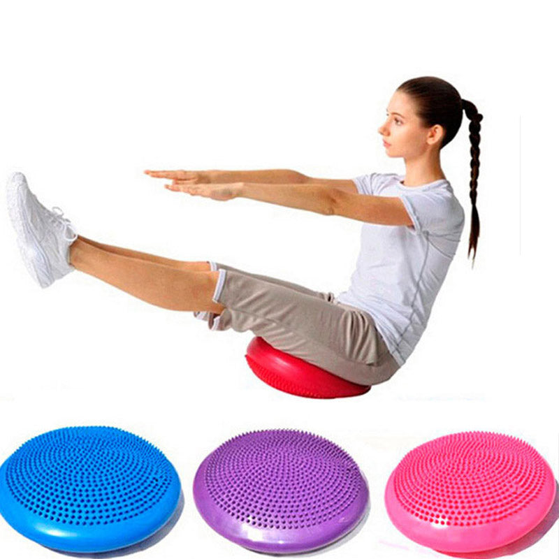 Round inflatable PVC balance cushion with dual-sided raised massage nubs, adjustable firmness and a diameter of 34 cm or 13.4 inches.
