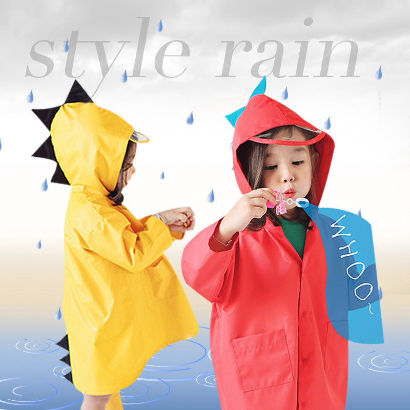 Two children wearing yellow and red dinosaur raincoats with clear hood brims and contrasting dinosaur spikes.