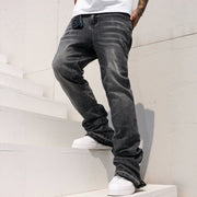 Men’s relaxed-fit stretch jeans with a mid-rise waist, straight-leg cut and slightly flared hem, available in black and blue.