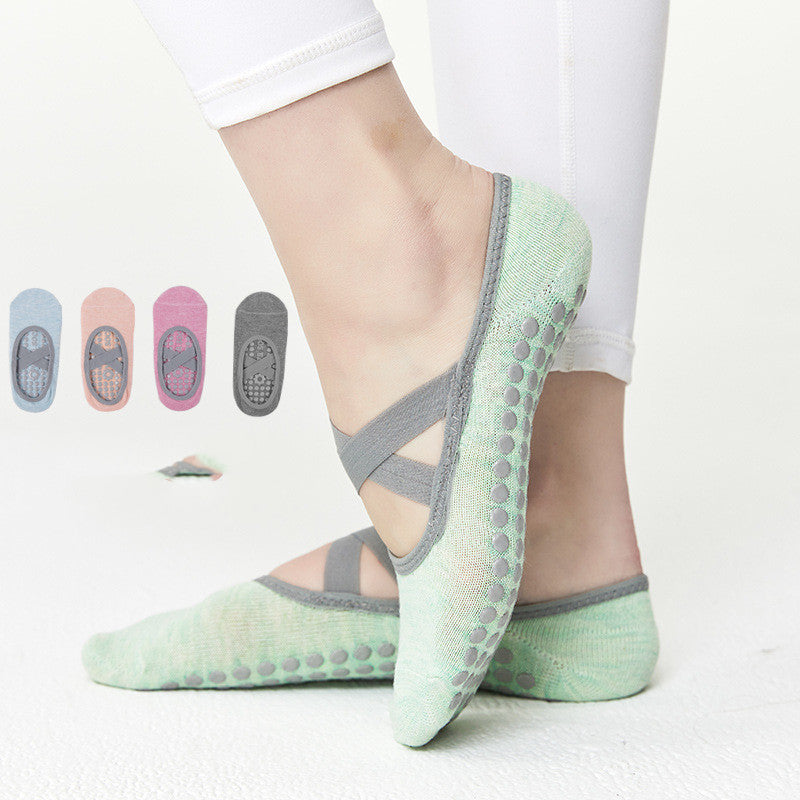 Women’s cotton yoga and Pilates socks with crossed top straps and non-slip grip soles, available in five colours and fitting approximately EU sizes 35 to 40.