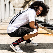 Breathable adult sports socks with sweat-absorbing and deodorising properties in white, black-and-white and black-and-red styles