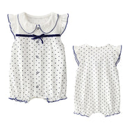 Sleeveless 100% cotton summer romper for baby girls, available in ten playful prints and sizes from 59 to 90 cm.