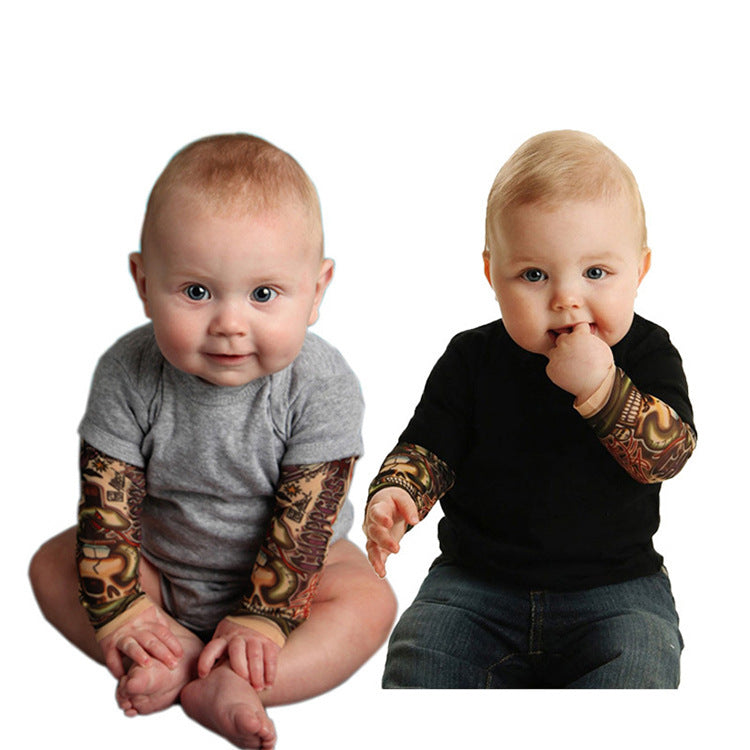 Cotton tattoo-print long-sleeve baby romper for boys, available in black and grey and sizes from 70 to 100 cm.