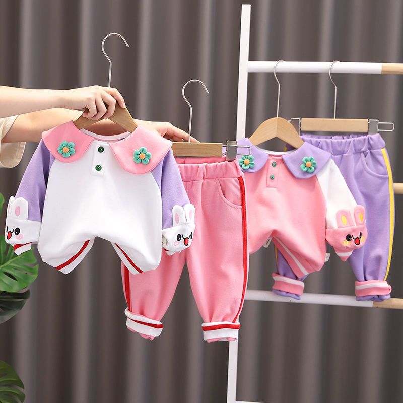 Cotton two-piece autumn outfit for baby girls with a matching top and trousers, available in pink or white.