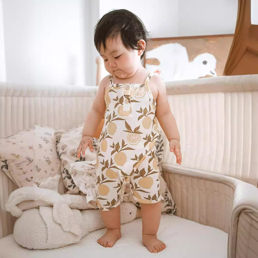 Cotton waffle summer baby jumpsuit available in animal garden, elephant, lemon and panda prints and sizes from 66 to 90 cm.