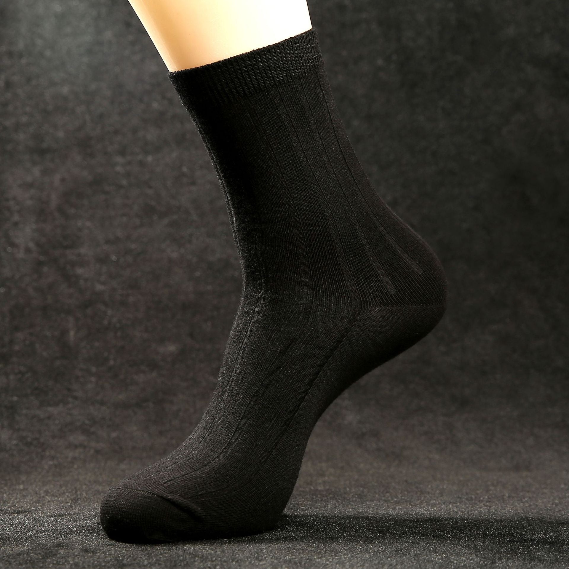 Black men’s mid-calf combed cotton dress sock with a subtle ribbed upper and solid-colour design