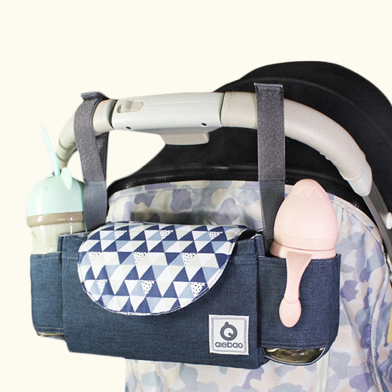 Medium multifunctional baby stroller organiser bag made from 300D cationic fabric with hanging straps and multiple colour options.