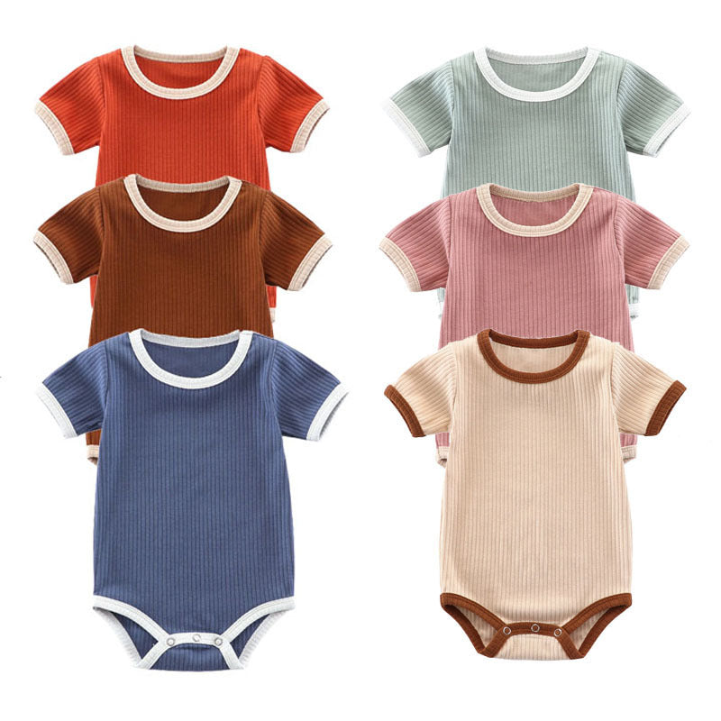 Ribbed knitted cotton short-sleeve baby romper available in six colours and sizes from 3 to 12 months.