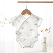 Short-sleeve cotton baby tie romper with a diagonal front opening, available in puppy, panda and pineapple prints.