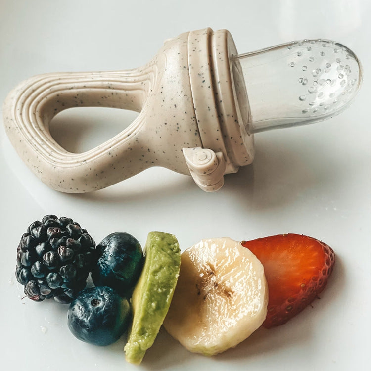 Silicone baby food feeder and fruit teether with an easy-grip handle for introducing fruit and vegetables during weaning.