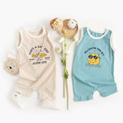 Sleeveless cotton baby jumpsuit available in blue sun and khaki surfboard prints for children aged 0–6 months to 2–3 years.