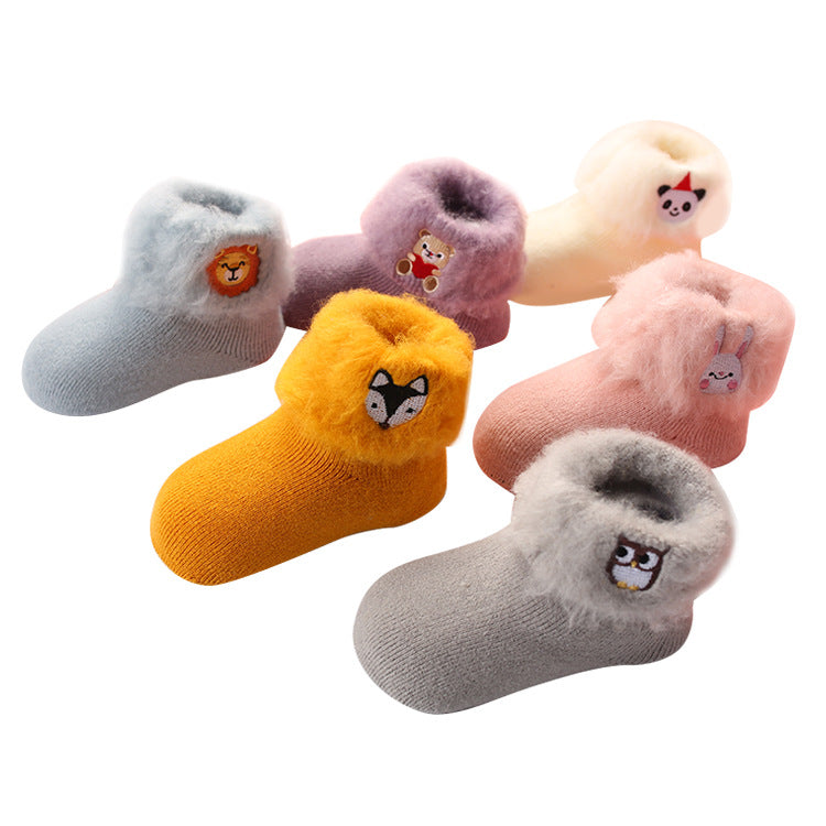 Thick brushed winter baby socks with cartoon embroidery, available in six colours and sizes for ages 0 months to 3 years.