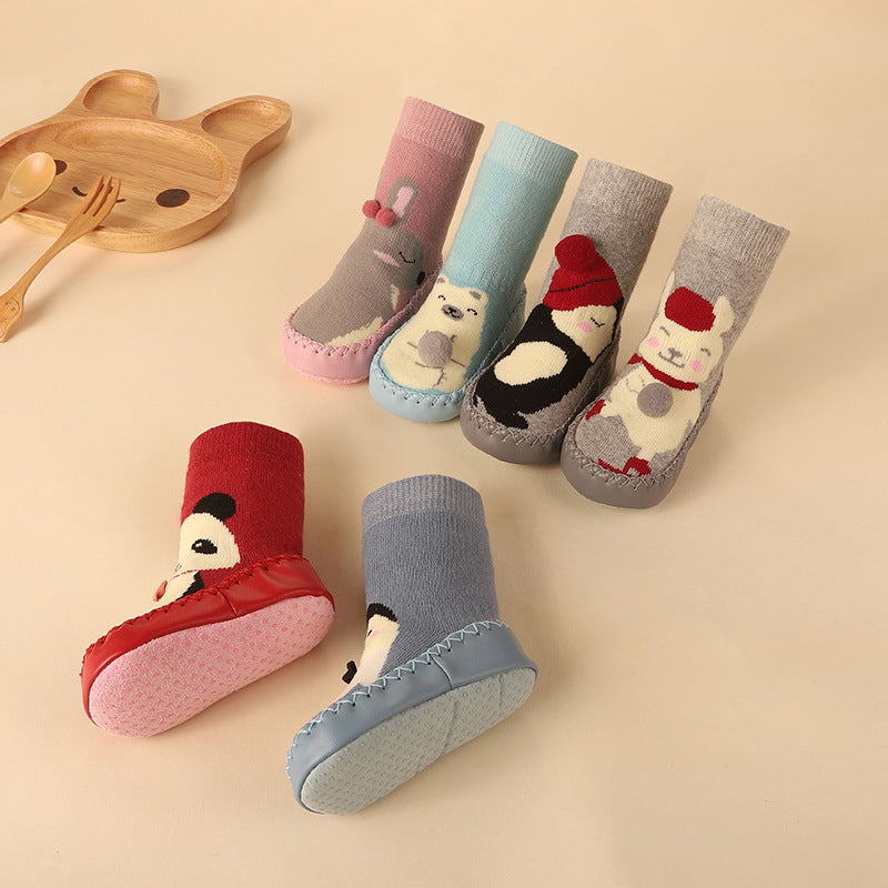 Thick terry anti-slip baby socks with colourful cartoon characters and gripped soles for comfortable indoor wear.