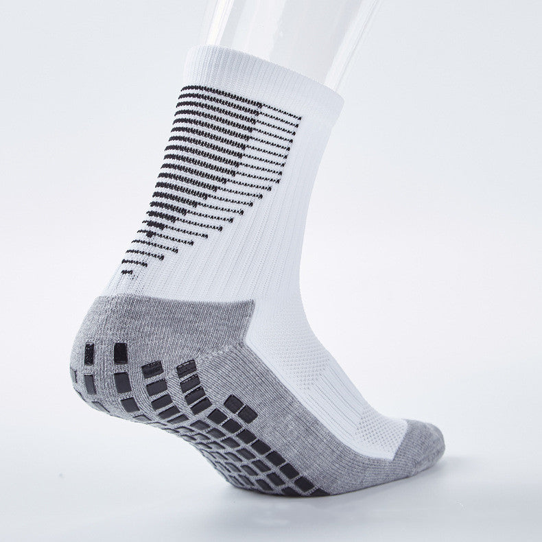 White and grey unisex mid-calf sports sock with black anti-slip grip sole and reinforced heel and toe areas