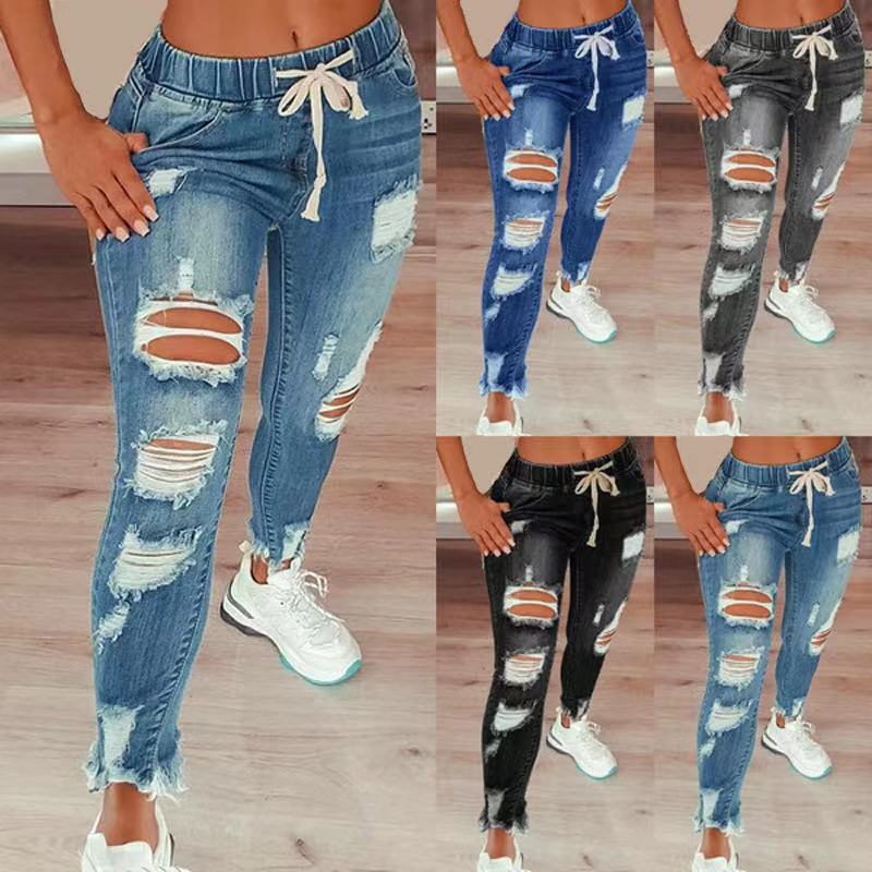 Women’s high-waisted ripped harem jeans with an elastic drawstring waistband, loose full-length fit and distressed detailing